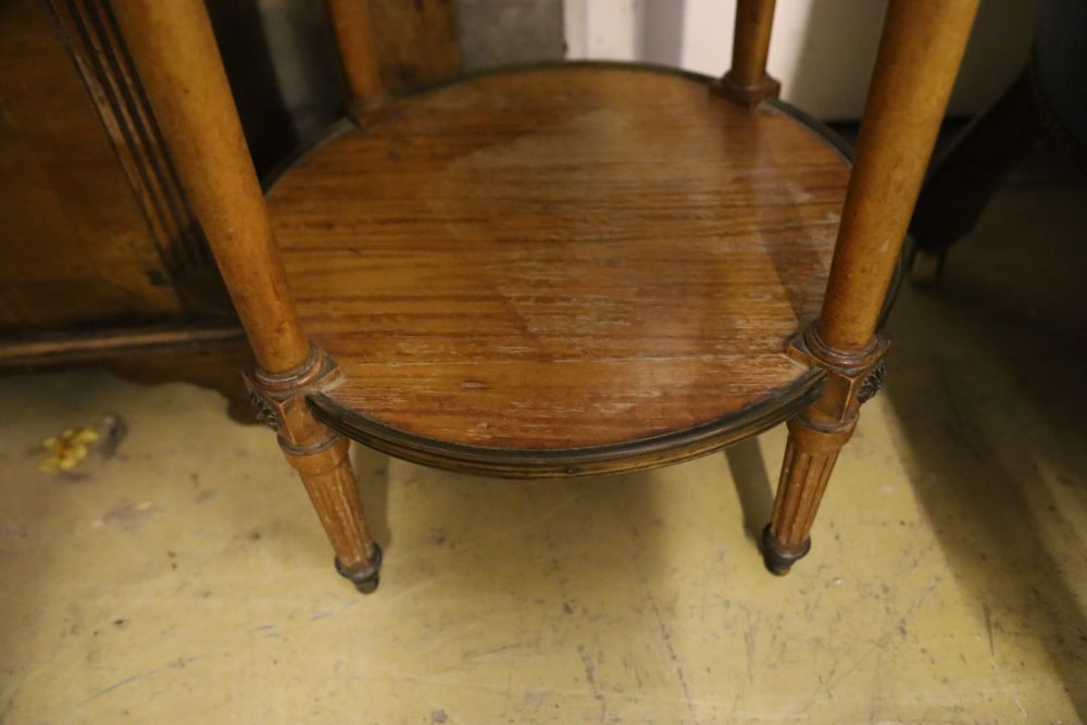 A Haentges Freres, Paris, circular marble top two tier table, diameter 47cm, height 84cm